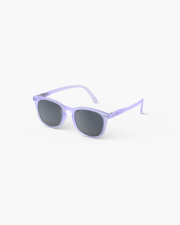 Translucent lavender kids' sunglasses with rounded rectangular frames and dark grey lenses on a white background.