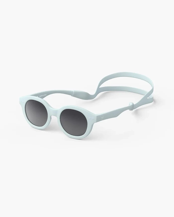 Pale blue toddler sunglasses with round frames, dark lenses, and a matching adjustable silicone head strap.