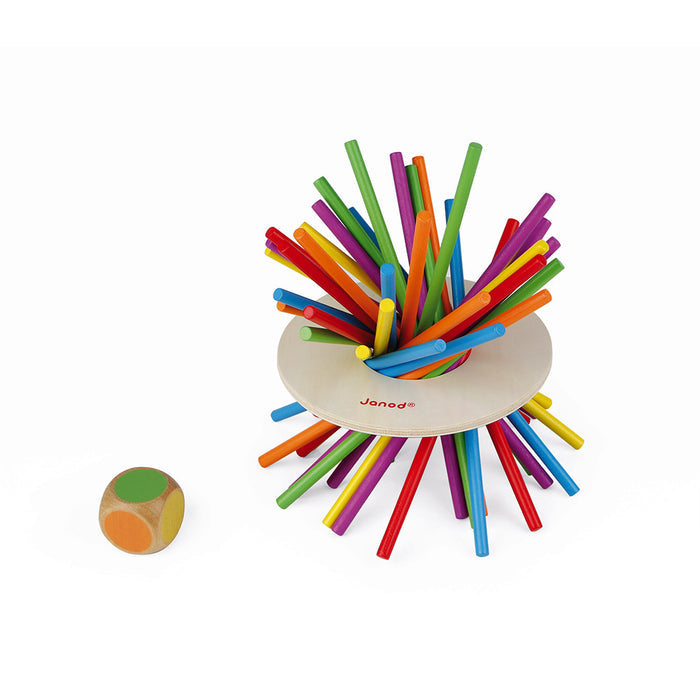 Colorful wooden sticks fanned out through a wooden ring with a color-coded wooden die on a white background.