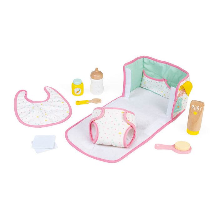 Pink polka dot doll changing bag set with wooden bottle, food jar, diaper, bib, and brush accessories.