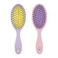 Purple and pink hairbrushes with gingham patterns and small butterfly floral illustrations on the handles.