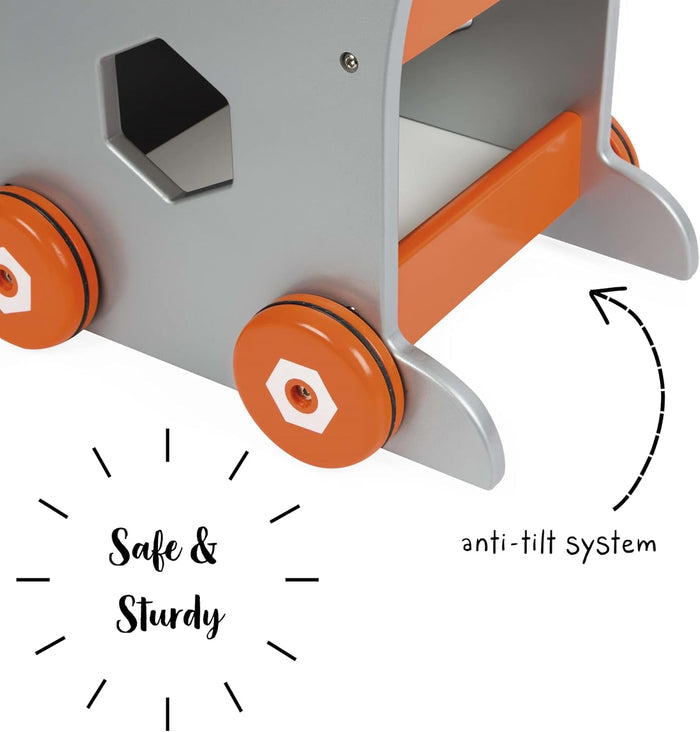 Close-up of a grey and orange toy trolley featuring orange wheels and curved rear anti-tilt stabilizer feet.