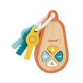Wooden toy car fob with 4 colored buttons and 3 plastic keys in yellow, teal, and blue attached to a white ring.