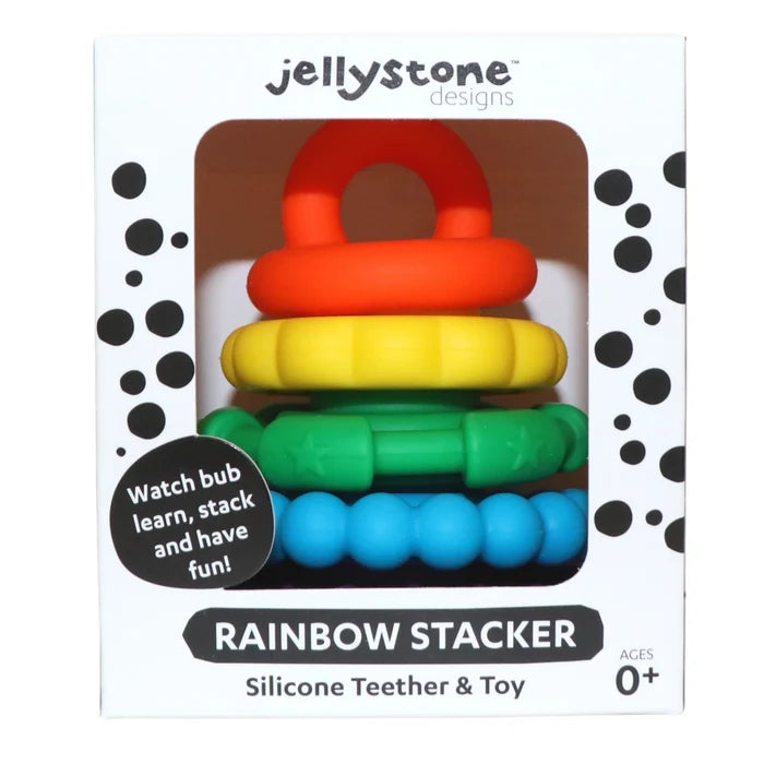 Stacked red, yellow, green, and blue textured silicone rings in a white box with black dots.