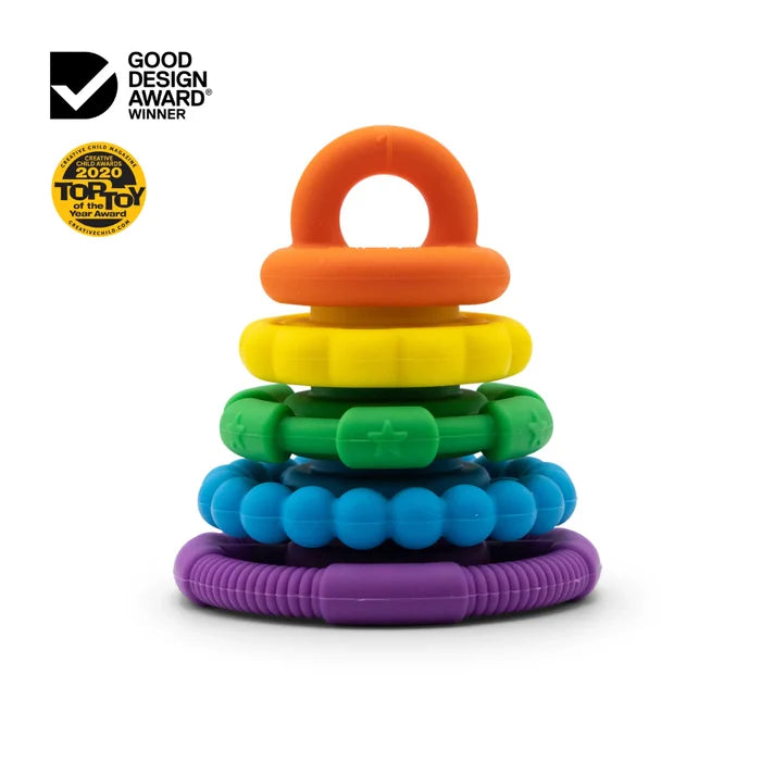 Textured silicone stacking rings in purple, blue, green, yellow, and orange with a top loop handle.