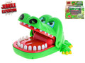 Bright green toy crocodile with wide-open jaw and white teeth. Product packaging shown in the corner.