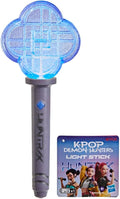 Blue glittery four-leaf clover light stick with a grey HUNTRAX handle and K-Pop Demon Hunters packaging tag.