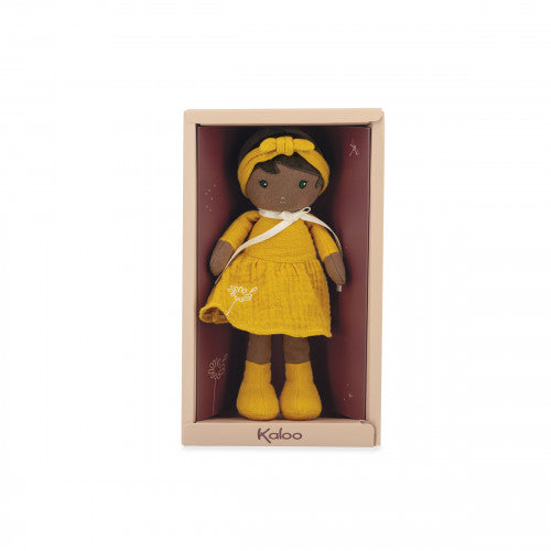 Soft cloth doll with dark skin wearing a yellow dress and matching headband, packaged in a decorative gift box.