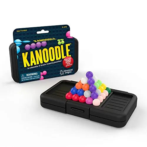 Colorful beads stacked in a 3D pyramid on a black portable game tray next to the Kanoodle retail packaging box.