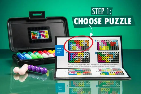 Open black case with colorful bead pieces and a puzzle booklet. Text reads Step 1: Choose Puzzle.