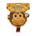 Brown monkey-shaped whoopee cushion with a smiling face and red valve, inside plastic packaging with a colorful header.
