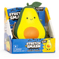 Smiling green and yellow avocado squeeze toy with a leaf top in a blue and yellow Stretch 'N Smash branded display box.