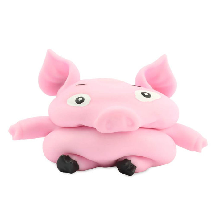 Pink squishy pig toy with a wide, flattened face, large ears, and black hooves in a squashed pose.