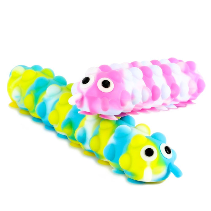 Two bumpy silicone caterpillar toys with big eyes: one pink and white marbled, one blue, green, and yellow marbled.