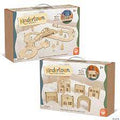 Two boxes of Kindertown solid wood toys: a winding road set and a collection of miniature town buildings and arches.