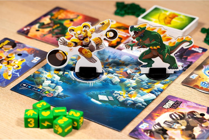 Green dinosaur and yellow robot standees on a city board with green dice and character cards on a wooden table.