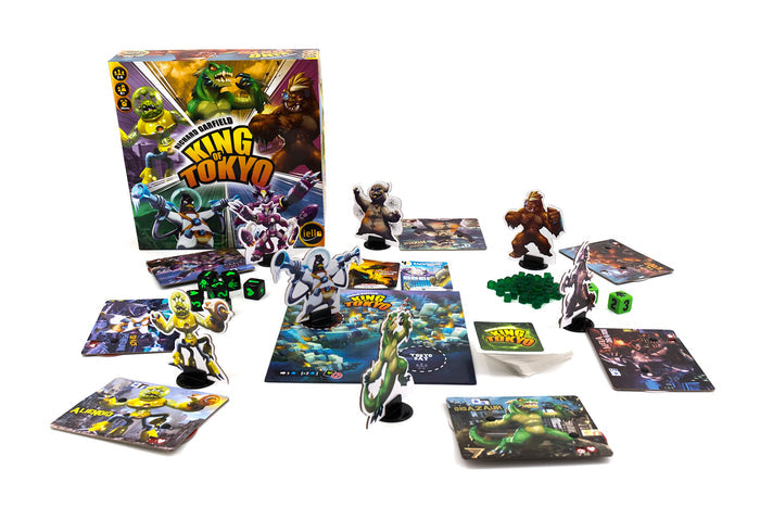 Board game 'King of Tokyo' with game pieces and cards on a white background