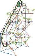 Tall toy roller coaster with a neon green track, colorful framework, and a car ascending a black chain lift.