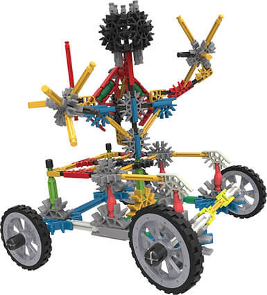 Colorful K'NEX toy vehicle with three black wheels, yellow rods, and blue connectors in a tall, complex design.