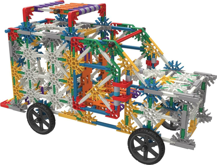 Intricate toy truck model built with multicolored plastic rods and connectors, featuring four black wheels.