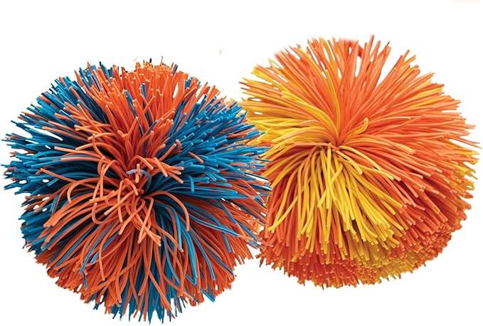 Two round, shaggy balls made of colorful rubber strands. One is blue and orange, the other is yellow and orange.