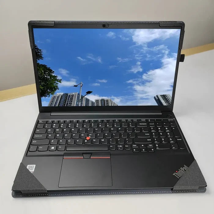 Laptop displaying a cityscape and sky reflection, compatible with Lenovo ThinkPad E15 Gen 3. Use with NauXlu Laptop Sleeve.