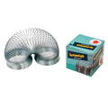 Silver metal coil spring toy stretched in an arch beside its light blue branded box.