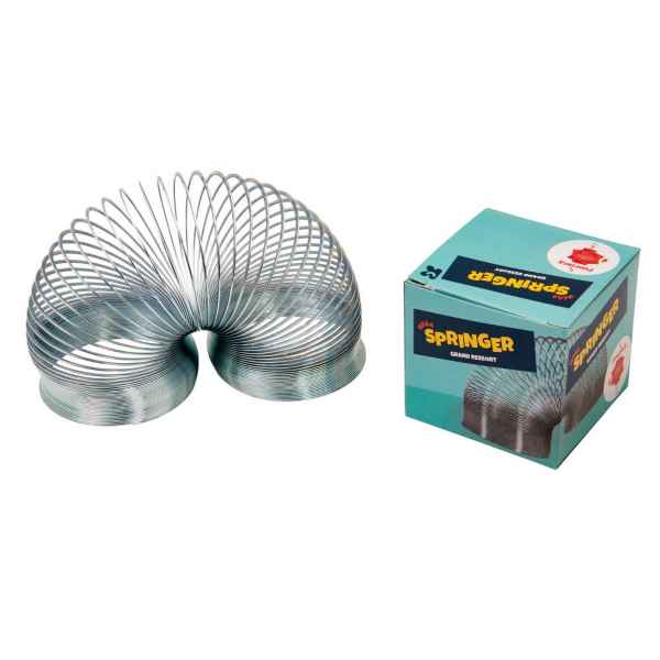 Silver metal coil spring toy stretched in an arch beside its light blue branded box.