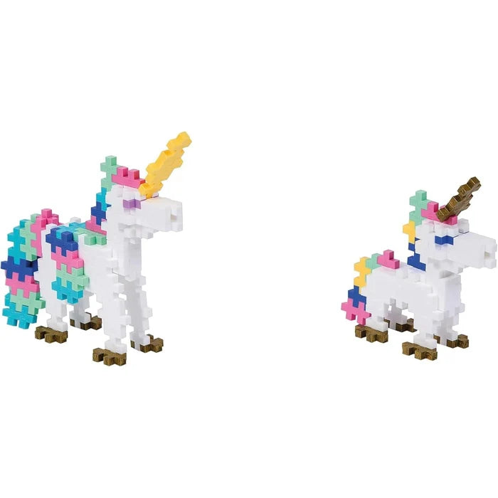 Two white toy unicorns made of colorful interlocking plus-shaped blocks, one large and one small.