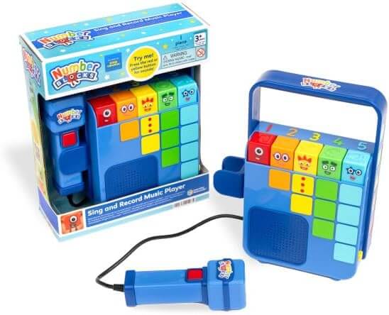 Blue toy music player with colorful numbered blocks and a wired microphone, shown beside its retail packaging.