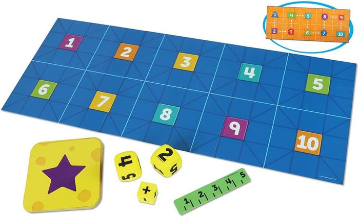 Blue grid mat with colorful numbered tiles, math symbol and number dice, star card, and green number line strip.