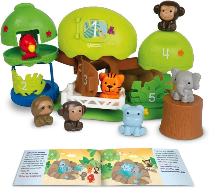 Colorful jungle playset with a numbered green treehouse, seven animal figures, and an open illustrated storybook.