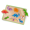 Wooden dinosaur peg puzzle with nine colorful pieces and small red handles on a light wood board with a green border.