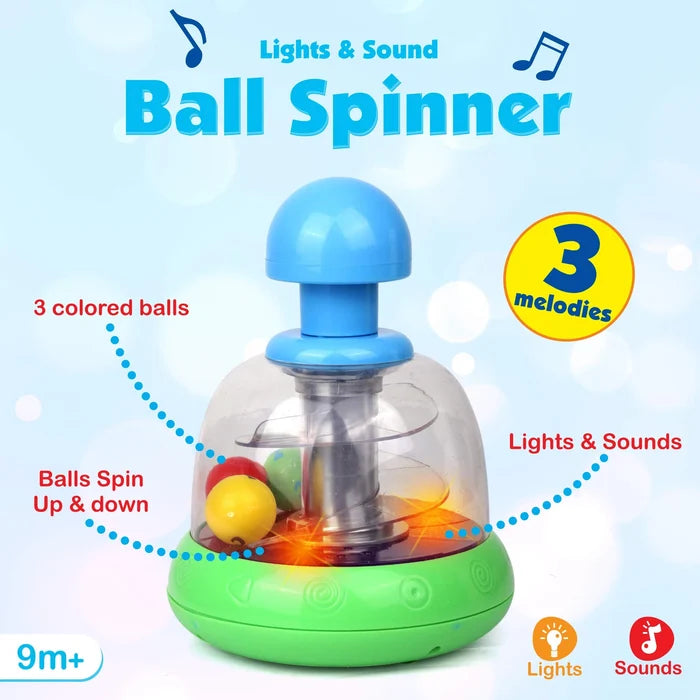 Clear dome toy with blue plunger and green base. Three colorful balls inside spin over glowing orange lights.