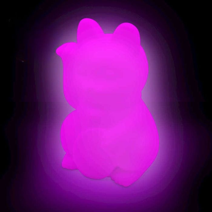 A bright pink glowing cat-shaped squishy light with rounded ears and a raised paw against a dark background.