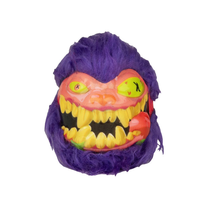 Purple furry ball with a pink face, sharp yellow jagged teeth, and yellow eyes with black X pupils.