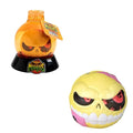 Yellow monster ball with red eyes and white teeth next to its orange potion bottle packaging on a black base.