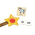 Yellow star magic wand with red center next to a cow illustration tile and letter tiles o and w.