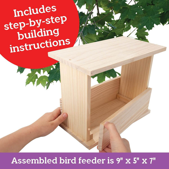 Hands building a light wood bird feeder. Overlays note step-by-step instructions and 9-by-5-by-7-inch assembled size.