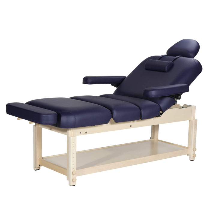 high-resolution studio display of a multi-section salon couch showcasing a matching navy blue massage table length extension seamlessly plugged into the footrest accessory ports; demonstrates how day spa owners and clinical physiotherapists in London can instantly extend their table surface area to comfortably accommodate tall clients without purchasing an entirely new bed.