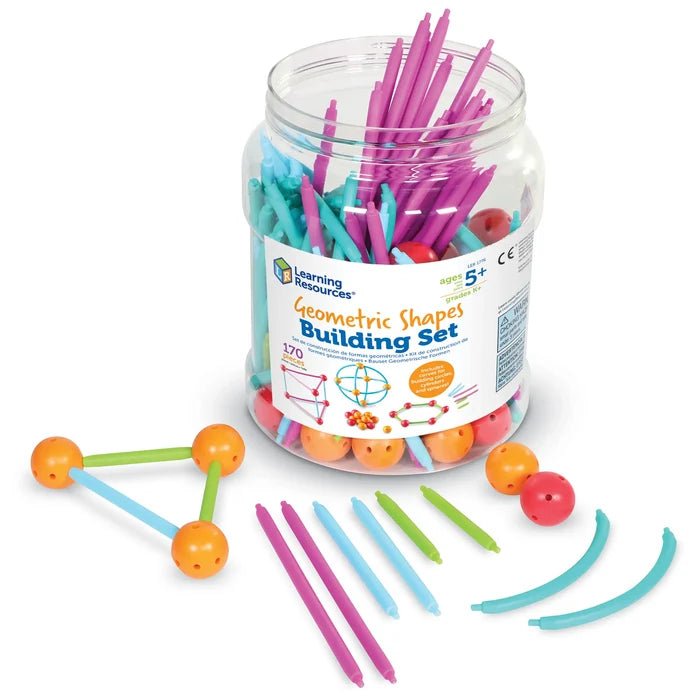 Clear plastic jar of colorful pink, blue, and green rods and orange sphere connectors on a white background.