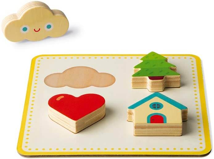 Wooden puzzle board with red heart, green tree, and house pieces. A smiling yellow cloud piece sits next to its slot.