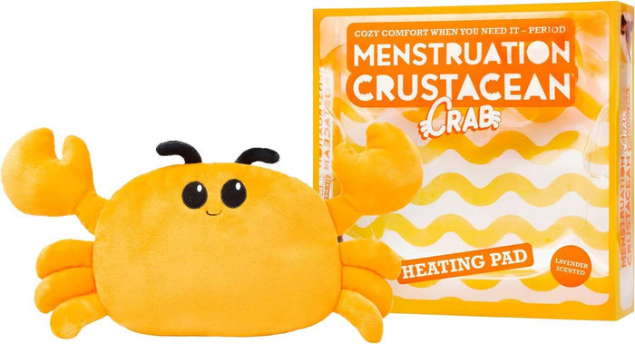 Plush orange crab with big claws beside its orange and white box labeled as a lavender-scented heating pad.