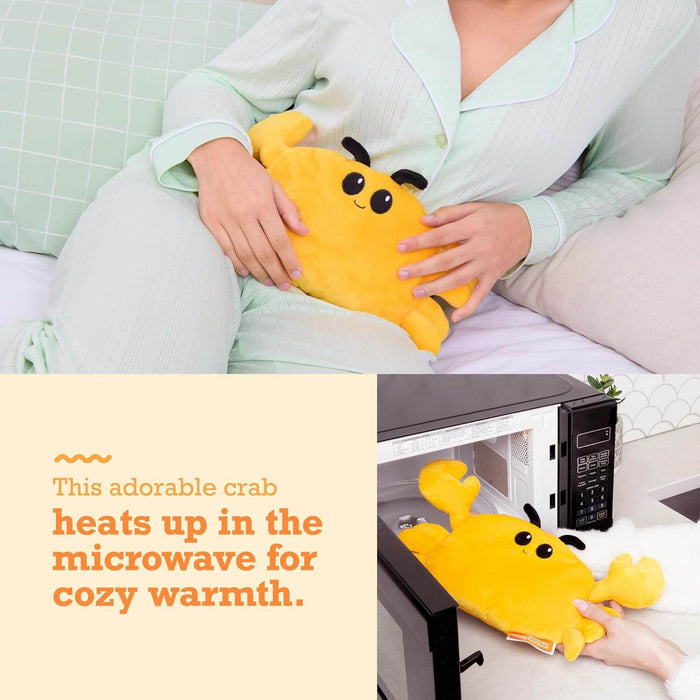 Soft yellow plush crab with a smiling face shown held on a lap and being placed inside a microwave.