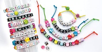Assorted colorful bracelets with letter beads spelling messages like SMILE and HOPE, plus star and flower-shaped beads.
