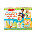 Melissa & Doug toy box showing a yellow owl hooded towel, rubber duck, lotion bottles, and children playing.