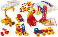 Red, yellow, and blue plastic building pieces assembled into toy vehicles, with a white storage bag and guide cards.