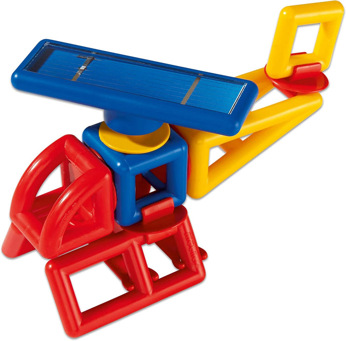 Toy helicopter built from red, yellow, and blue plastic geometric blocks with a blue solar panel rotor on top.