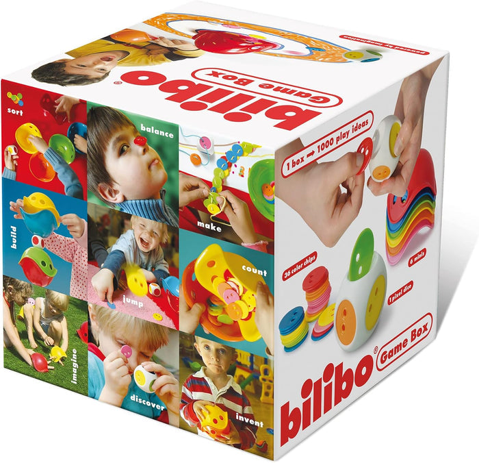White toy box showing children playing with colorful shell-shaped minis, small plastic discs, and a pixel dice.