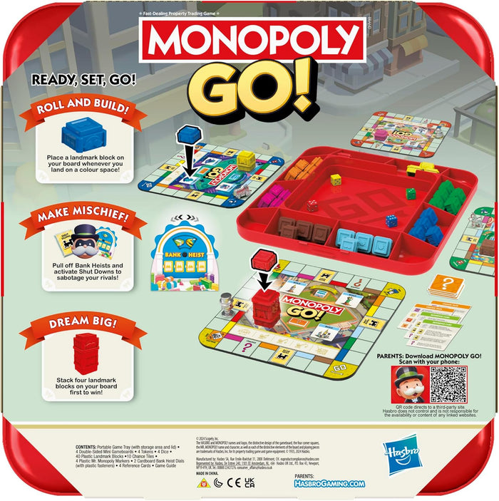Back of Monopoly GO! packaging showing a red game tray, mini boards, colorful building blocks, and dice.